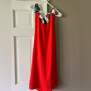 New with tags, Lulus Red/orange dress with open back and a big bow.